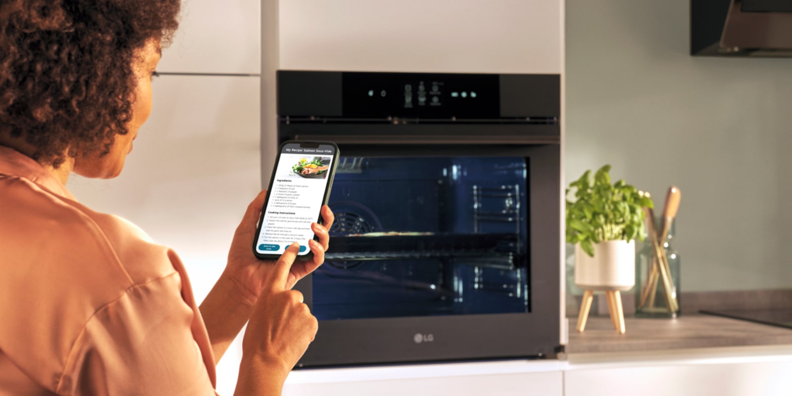 This is an image of a woman looking at a food recipe on her smartphone.